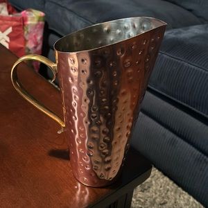 Dimpled metal copper colored pitcher